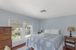 Sunny queen bedroom with dresser and closet with central AC vent